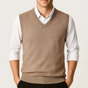 Men's sleeveless V-neck sweater vest layered over a collared shirt