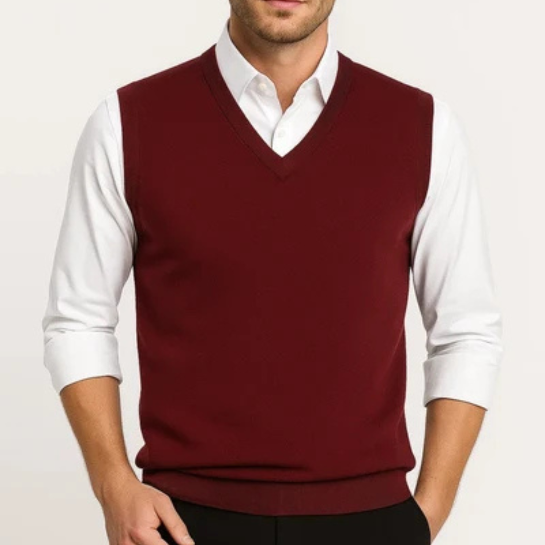 Men's sleeveless V-neck sweater vest layered over a collared shirt
