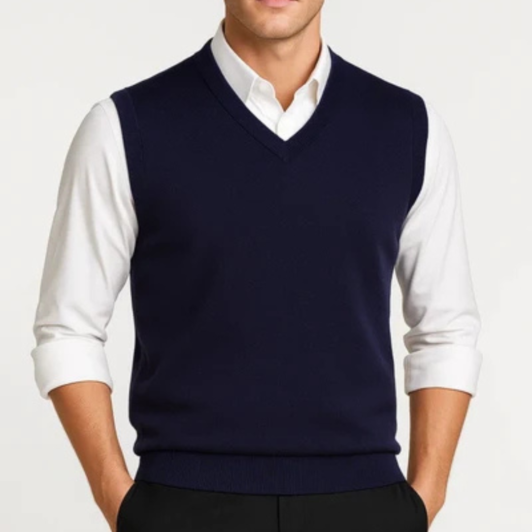 Men's sleeveless V-neck sweater vest layered over a collared shirt