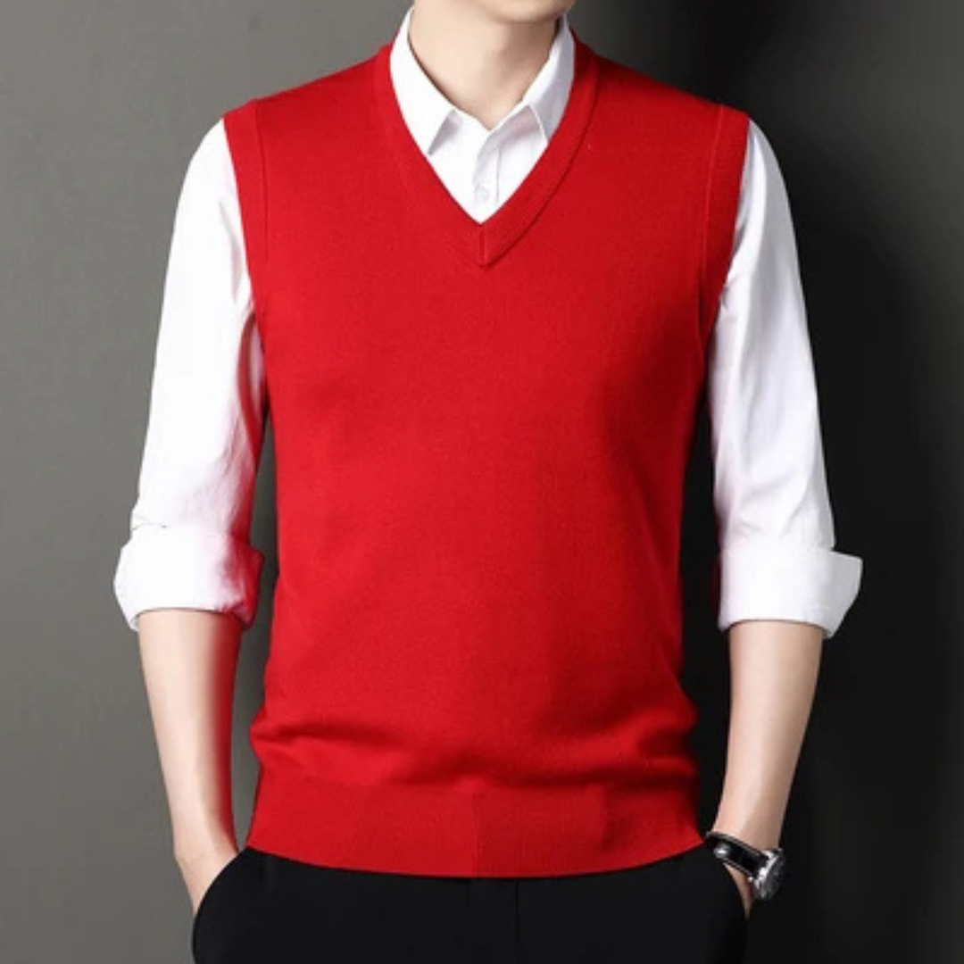 Men's sleeveless V-neck sweater vest layered over a collared shirt