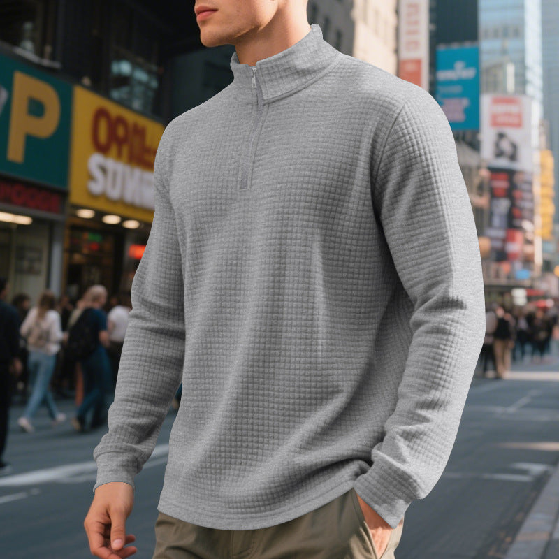 Men's textured half-zip sweatshirt with a high mock neck and long sleeves