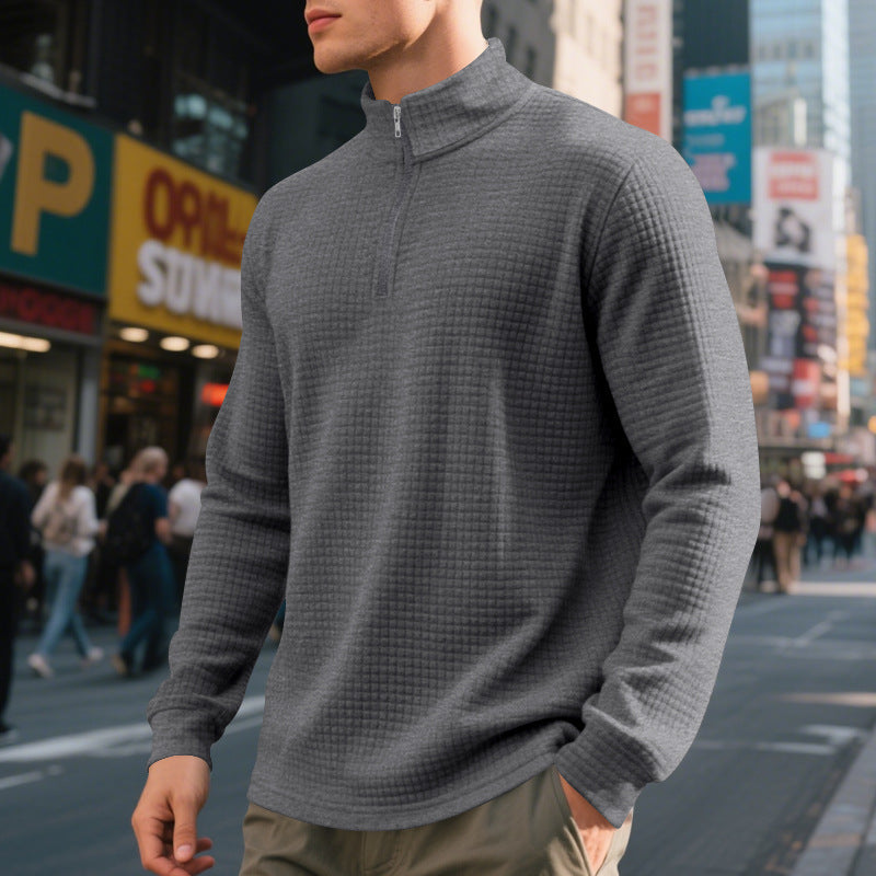 Men's textured half-zip sweatshirt with a high mock neck and long sleeves