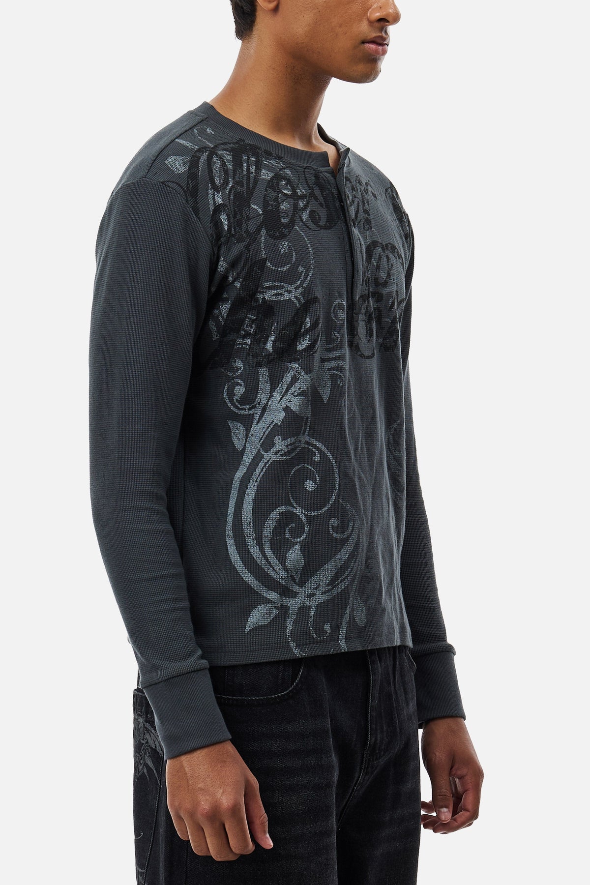 Men's dark grey long-sleeve Henley top with abstract scroll pattern