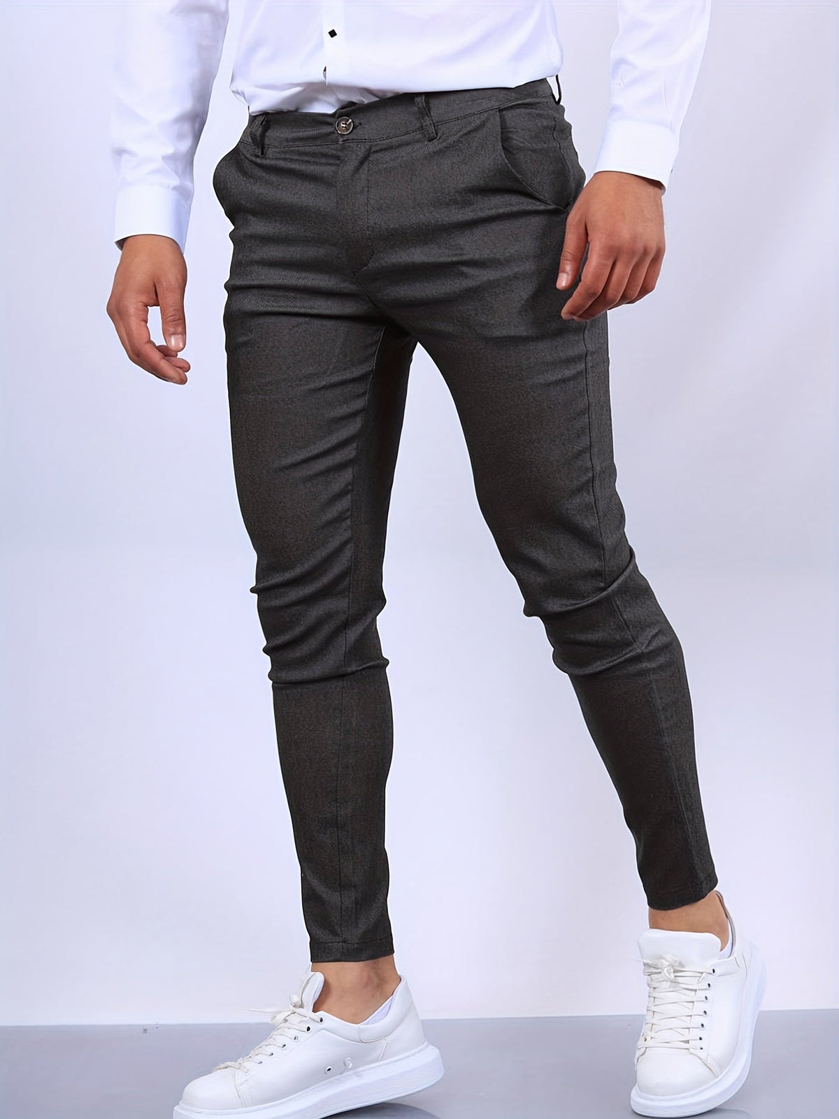 Men's skinny chino trousers with tapered legs and button fastening