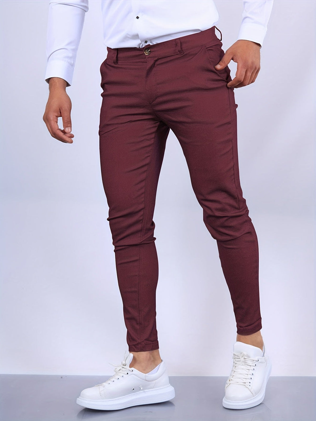 Men's skinny chino trousers with tapered legs and button fastening