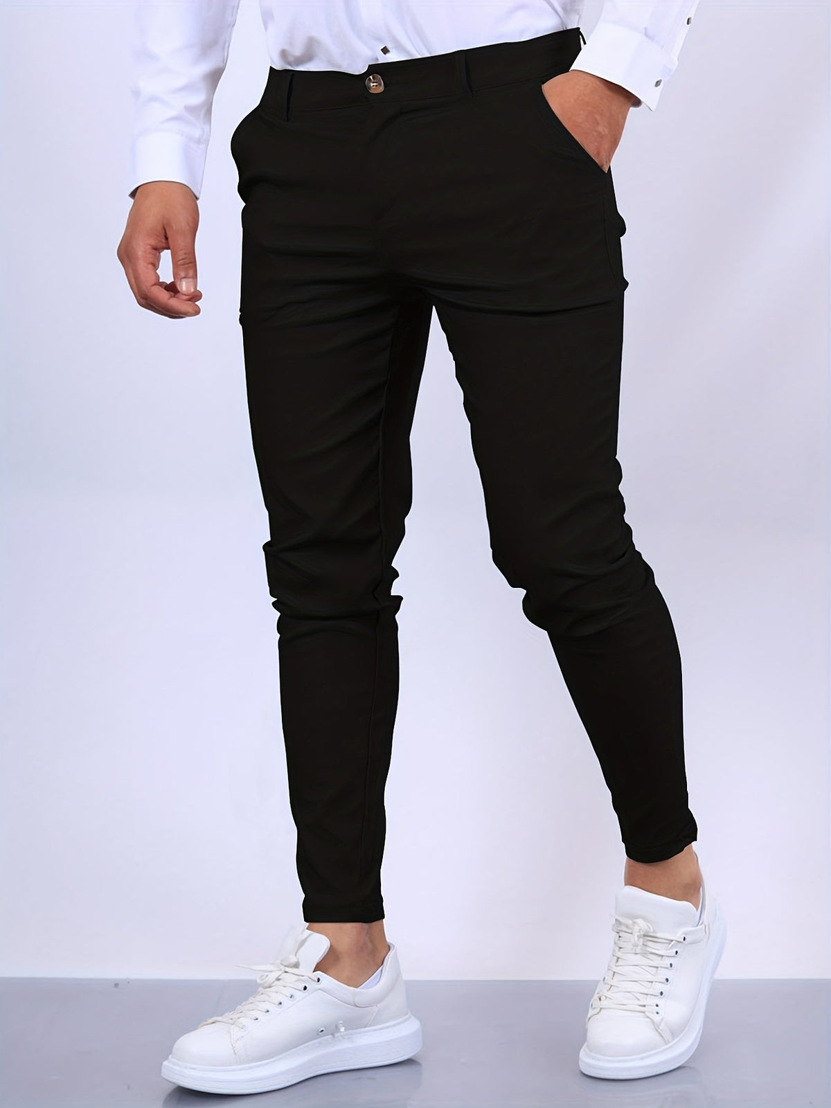 Men's skinny chino trousers with tapered legs and button fastening