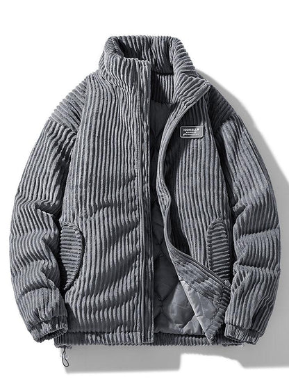 Ribbed padded jacket with high collar, zip front and zipped pockets