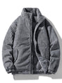 Ribbed padded jacket with high collar, zip front and zipped pockets