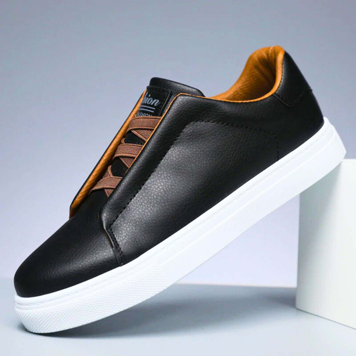 Low-top lace-up sneaker with contrast panelled upper and flat sole