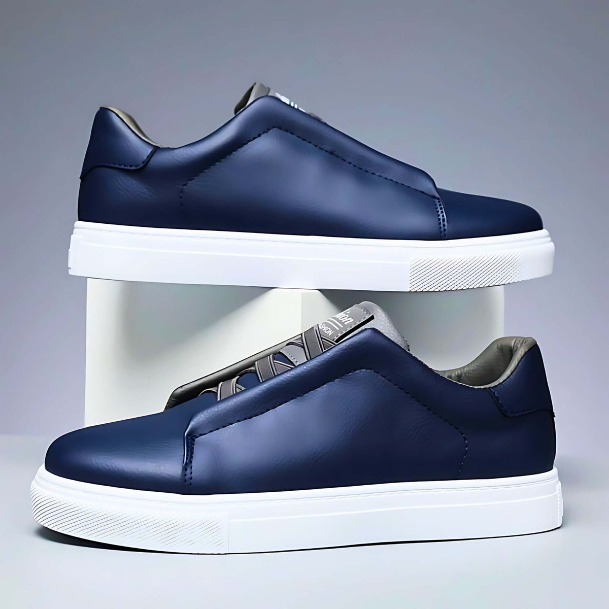 Low-top lace-up sneaker with contrast panelled upper and flat sole
