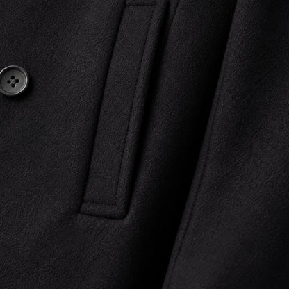 Men's black double-breasted peacoat with notched lapels and long sleeves