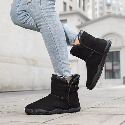 Barefoot ankle boots with fur trim, buckle straps and textured flat soles