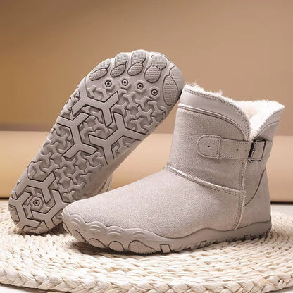 Barefoot ankle boots with fur trim, buckle straps and textured flat soles