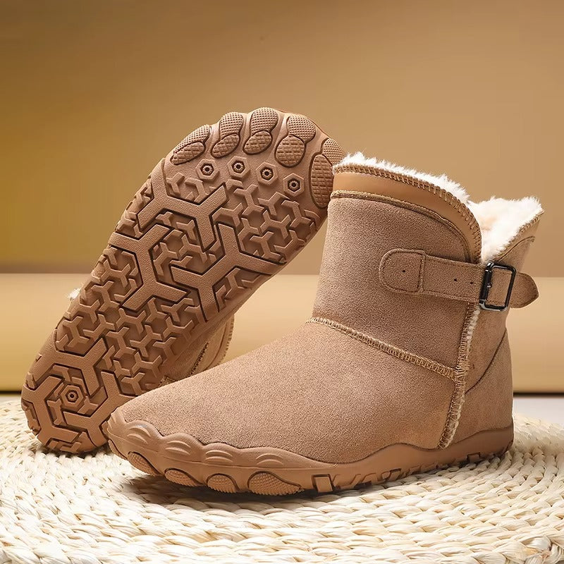 Barefoot ankle boots with fur trim, buckle straps and textured flat soles