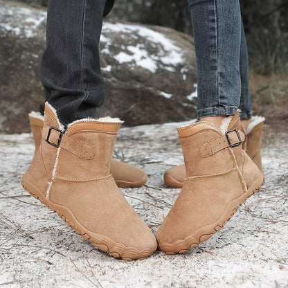 Barefoot ankle boots with fur trim, buckle straps and textured flat soles