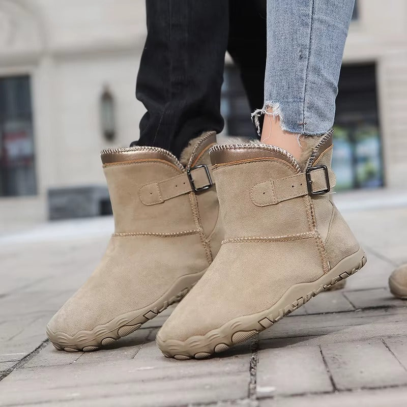 Barefoot ankle boots with fur trim, buckle straps and textured flat soles