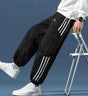 Men's fleece jogger trousers with contrast side stripes and elasticated cuffs