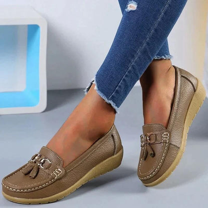 Women's slip-on tassel loafers with round toes, metal ring trims and low textured soles