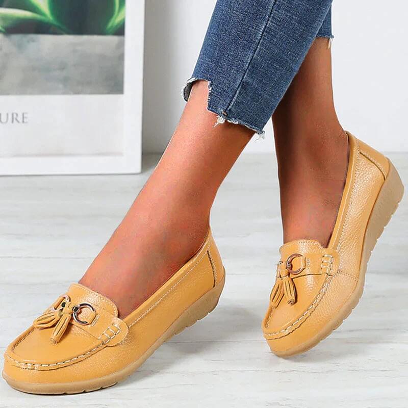 Women's slip-on tassel loafers with round toes, metal ring trims and low textured soles