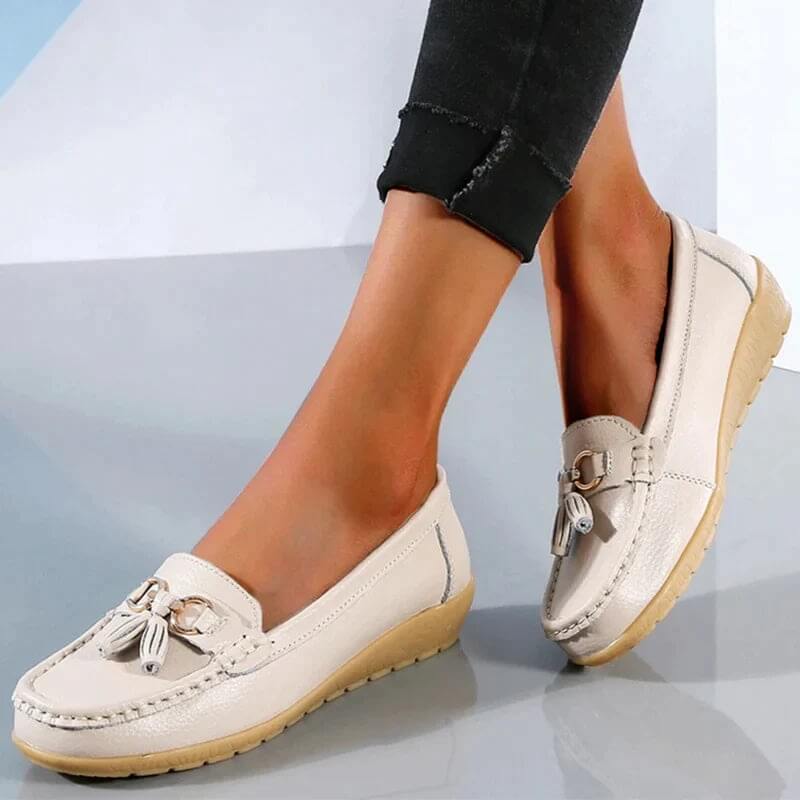 Women's slip-on tassel loafers with round toes, metal ring trims and low textured soles