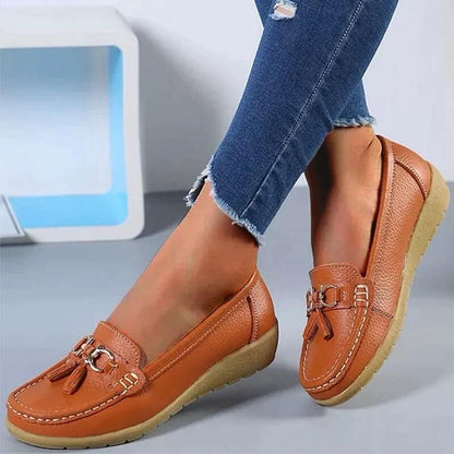 Women's slip-on tassel loafers with round toes, metal ring trims and low textured soles