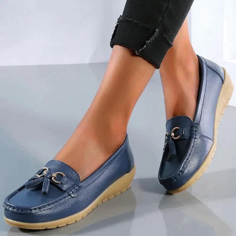 Women's slip-on tassel loafers with round toes, metal ring trims and low textured soles