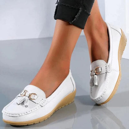 Women's slip-on tassel loafers with round toes, metal ring trims and low textured soles