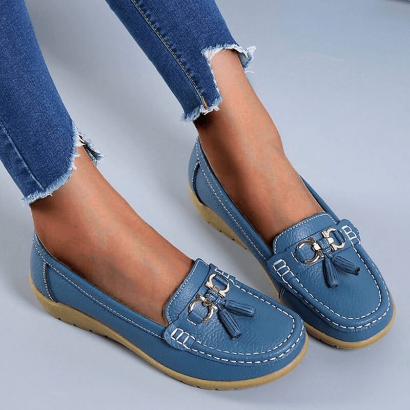 Women's slip-on tassel loafers with round toes, metal ring trims and low textured soles