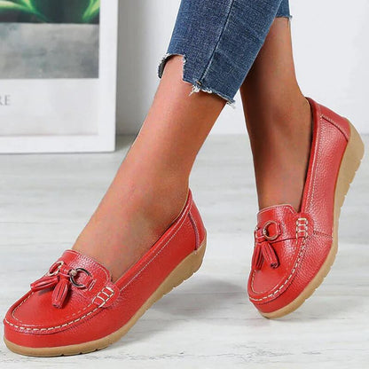 Women's slip-on tassel loafers with round toes, metal ring trims and low textured soles