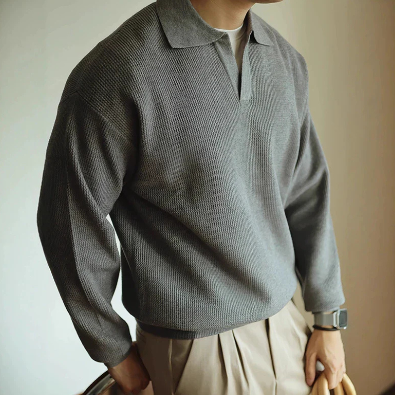Men's long-sleeve textured polo sweater with collared neckline and ribbed hem