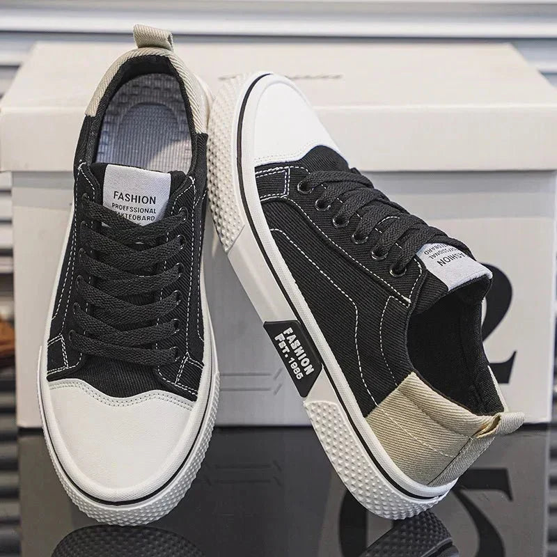 Low top lace-up trainers with panelled uppers, round toes and contrast soles