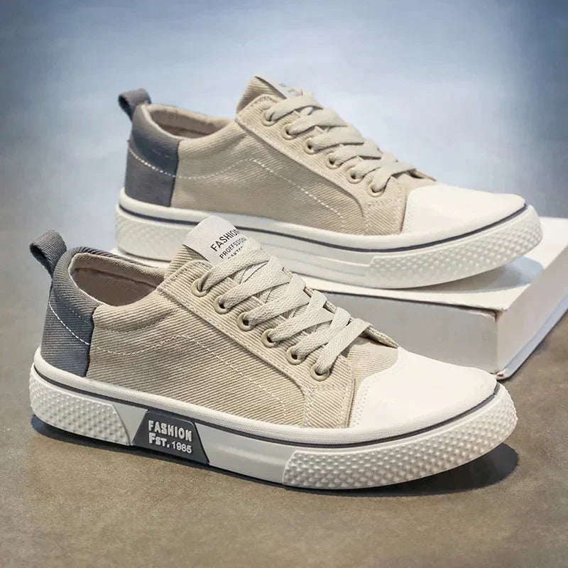 Low top lace-up trainers with panelled uppers, round toes and contrast soles