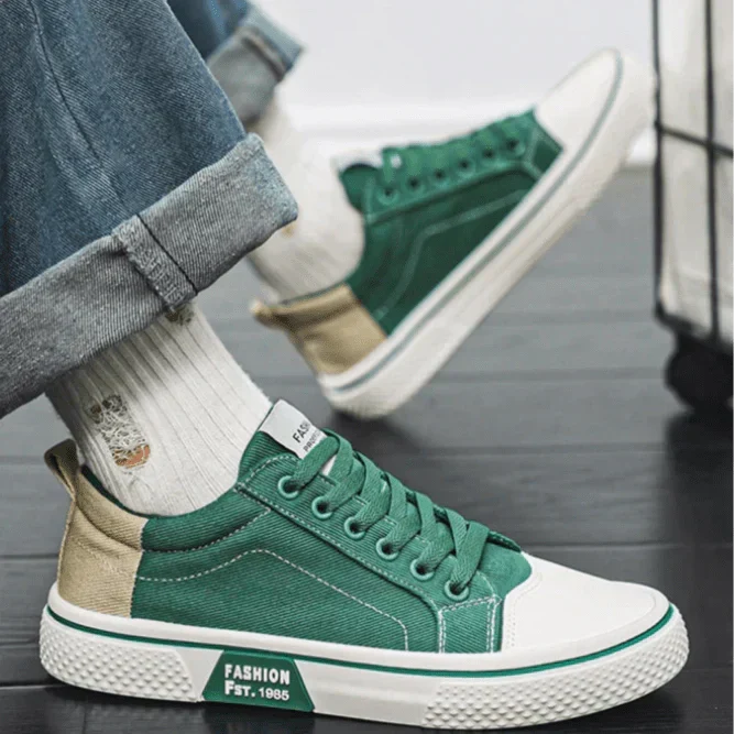 Low top lace-up trainers with panelled uppers, round toes and contrast soles