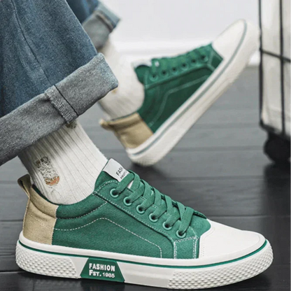 Low top lace-up trainers with panelled uppers, round toes and contrast soles