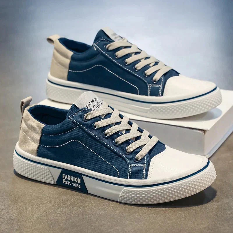 Low top lace-up trainers with panelled uppers, round toes and contrast soles