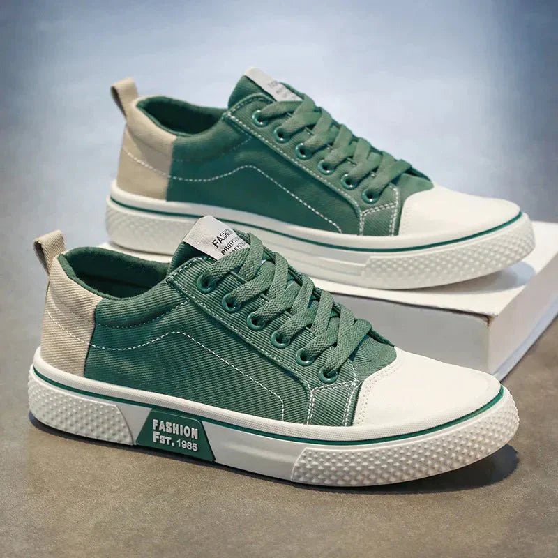 Low top lace-up trainers with panelled uppers, round toes and contrast soles