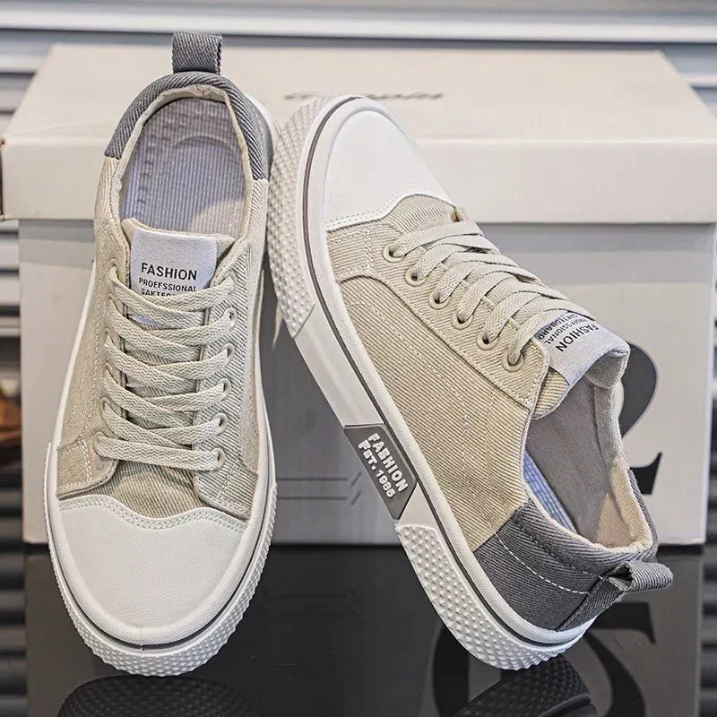 Low top lace-up trainers with panelled uppers, round toes and contrast soles