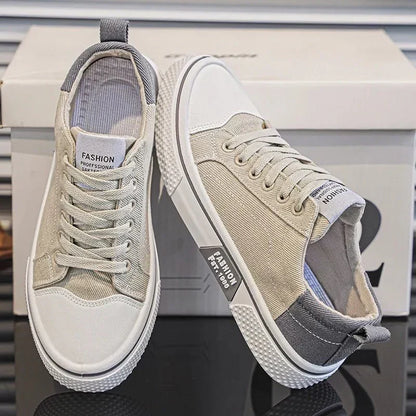 Low top lace-up trainers with panelled uppers, round toes and contrast soles