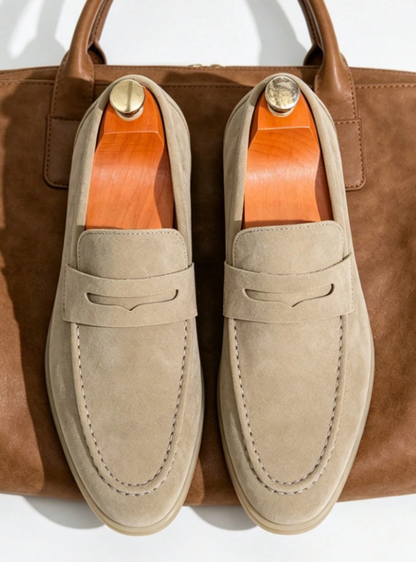Men's plain penny loafers with moc toe stitching and low heels