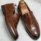 Men's penny loafers with front strap and almond toes