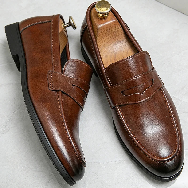 Men's penny loafers with front strap and almond toes