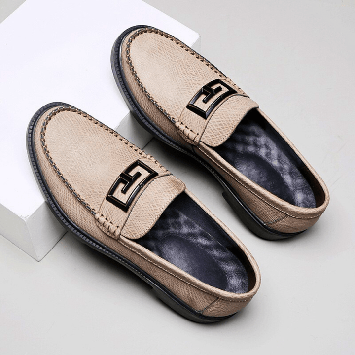 Textured slip-on loafers with geometric front trim and stitched toe detailing