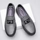 Textured slip-on loafers with geometric front trim and stitched toe detailing