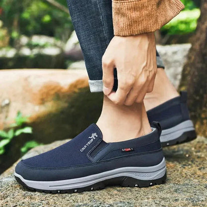 Men's slip-on walking shoe with textured upper, layered sole and treaded outsole