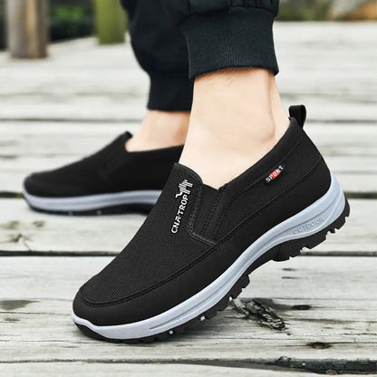 Men's slip-on walking shoe with textured upper, layered sole and treaded outsole