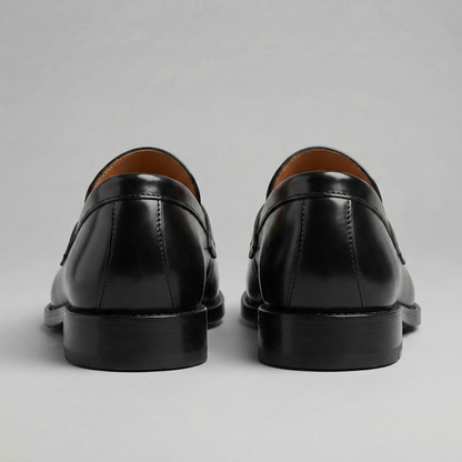 Men's black penny loafers with round toes and low block heels