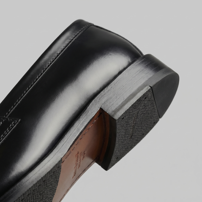 Men's black penny loafers with round toes and low block heels