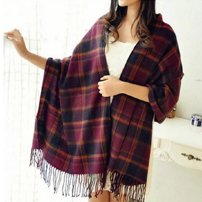 Oversized fringed wrap scarf shown draped around the shoulders and neck