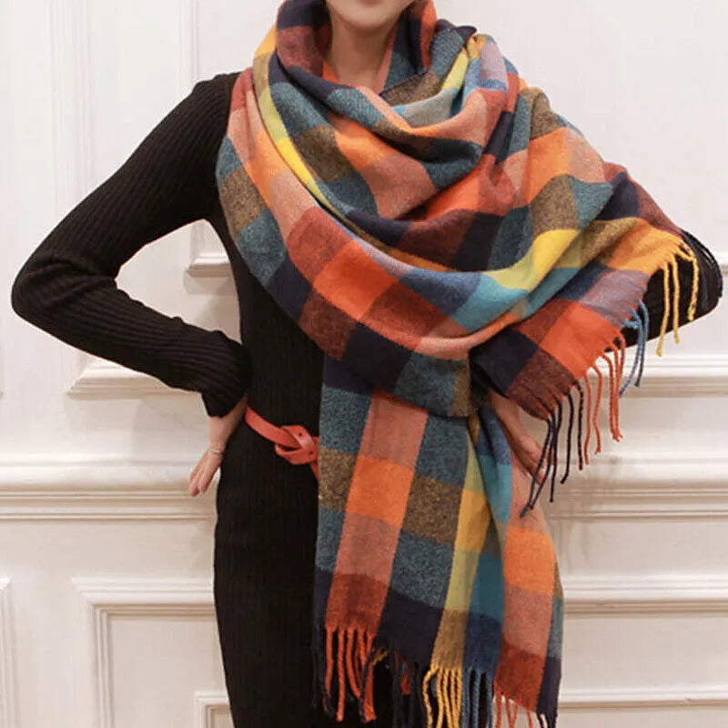 Oversized fringed wrap scarf shown draped around the shoulders and neck