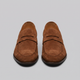 Men's penny loafers with rounded toes, strap detail and flat soles